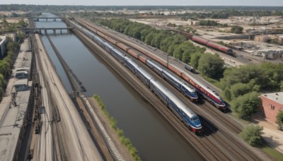 outdoors,day,tree,no humans,grass,ground vehicle,building,nature,scenery,motor vehicle,forest,city,car,road,bush,cityscape,watercraft,bridge,vehicle focus,river,train,railroad tracks,sky,military,military vehicle,landscape,truck,real world location