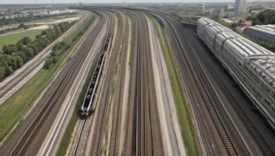 outdoors,sky,day,tree,no humans,grass,ground vehicle,building,nature,scenery,motor vehicle,city,road,bridge,train,train station,railroad tracks,real world location,cloud,forest,realistic,cityscape,field,river,landscape