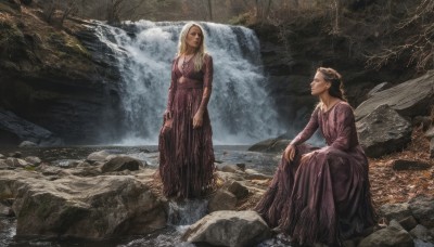 long hair,multiple girls,blonde hair,brown hair,black hair,long sleeves,dress,2girls,sitting,standing,braid,water,looking at another,tree,wet,purple dress,wading,rock,realistic,river,waterfall,cave,fine art parody,outdoors,necklace,wet clothes,scenery