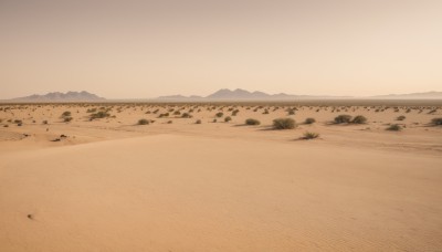 monochrome,outdoors,sky,no humans,ocean,beach,grass,scenery,rock,mountain,sand,horizon,field,landscape,mountainous horizon,shore,desert,footprints