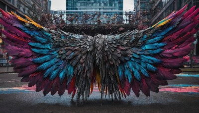 outdoors,wings,day,blurry,no humans,feathers,ground vehicle,building,scenery,feathered wings,motor vehicle,city,car,road,street,crowd,multiple wings,multicolored wings,spread wings,people,crosswalk,6+others,cityscape,multiple others,colorful