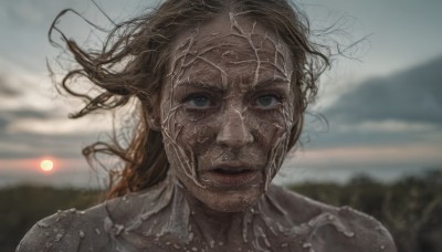 1girl,solo,long hair,looking at viewer,blue eyes,brown hair,outdoors,parted lips,sky,cloud,blurry,lips,grey eyes,floating hair,depth of field,blurry background,messy hair,portrait,realistic,sun,blonde hair,close-up,sunset,sunrise