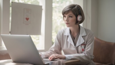 1girl,solo,short hair,brown hair,shirt,long sleeves,brown eyes,sitting,closed mouth,upper body,heart,indoors,blurry,lips,looking to the side,window,headphones,chair,looking away,table,headset,realistic,nose,computer,laptop,smile,labcoat