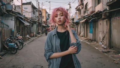 1girl,solo,looking at viewer,short hair,open mouth,shirt,brown eyes,jewelry,jacket,upper body,pink hair,outdoors,parted lips,open clothes,teeth,day,hand up,medium hair,lips,looking to the side,black shirt,buttons,ground vehicle,wind,building,scenery,motor vehicle,sleeves rolled up,city,realistic,red lips,car,road,motorcycle,power lines,street,bicycle,utility pole,denim jacket,green eyes,solo focus,blurry,open jacket,blurry background,denim,blue jacket,smoke,cigarette,sign,smoking,unbuttoned,holding cigarette,town