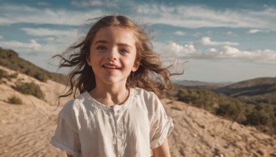 1girl,solo,long hair,looking at viewer,smile,open mouth,blue eyes,brown hair,shirt,white shirt,upper body,short sleeves,outdoors,parted lips,sky,teeth,day,cloud,blurry,blue sky,lips,floating hair,depth of field,blurry background,cloudy sky,wind,messy hair,child,mountain,realistic