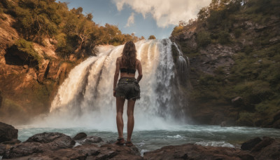 1girl, solo, long hair, brown hair, standing, outdoors, sky, shorts, day, cloud, water, from behind, tree, short shorts, sandals, denim, nature, scenery, denim shorts, rock, facing away, cutoffs, river, waterfall