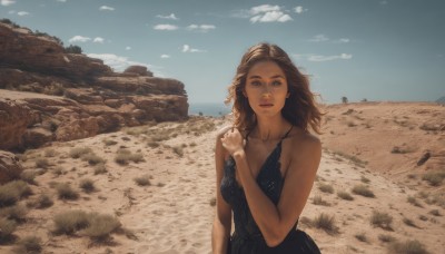 1girl,solo,long hair,breasts,looking at viewer,blue eyes,brown hair,dress,cleavage,bare shoulders,jewelry,medium breasts,upper body,outdoors,parted lips,sky,sleeveless,day,cloud,medium hair,black dress,blue sky,lips,bare arms,sleeveless dress,beach,scenery,realistic,sand,desert,open mouth,collarbone,earrings,teeth,necklace,mole,wind,rock