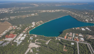 outdoors,sky,day,water,no humans,ocean,from above,building,scenery,city,horizon,road,cityscape,watercraft,river,boat,landscape,rooftop,shore,city lights,town,cloud,tree,blue sky,nature,forest,real world location