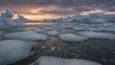 outdoors,sky,cloud,water,tree,no humans,cloudy sky,scenery,snow,sunset,mountain,sun,horizon,winter,landscape,mountainous horizon,signature,ocean,ice,shore,footprints