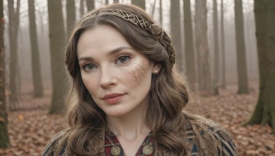 1girl,solo,long hair,looking at viewer,smile,brown hair,brown eyes,jewelry,closed mouth,hairband,earrings,outdoors,day,blurry,tree,lips,depth of field,blurry background,facial mark,portrait,nature,forehead,forest,freckles,curly hair,realistic,nose,parted lips,eyelashes,tattoo