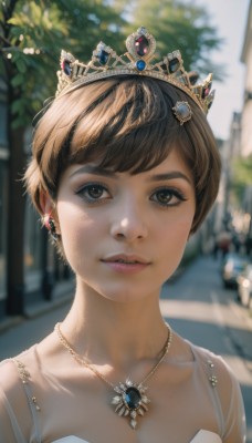 1girl,solo,breasts,looking at viewer,smile,short hair,bangs,brown hair,hair ornament,dress,bare shoulders,brown eyes,jewelry,collarbone,upper body,earrings,outdoors,parted lips,teeth,day,necklace,white dress,blurry,lips,eyelashes,depth of field,blurry background,piercing,sunlight,tiara,crown,gem,portrait,freckles,realistic,nose,very short hair,cleavage