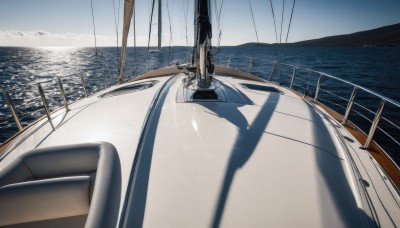 outdoors,sky,day,cloud,water,blue sky,no humans,shadow,ocean,cloudy sky,scenery,railing,horizon,watercraft,ship,boat,grey sky,dock