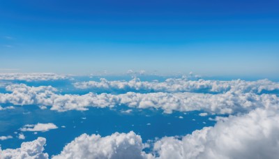 monochrome,outdoors,sky,day,cloud,blue sky,no humans,cloudy sky,scenery,blue theme,horizon,above clouds,bird,ocean,flock