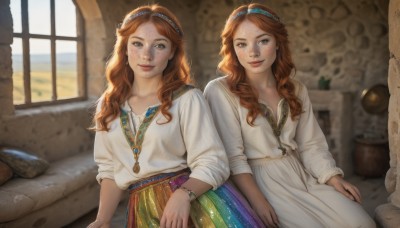 long hair,looking at viewer,blush,smile,multiple girls,skirt,brown hair,shirt,long sleeves,dress,2girls,brown eyes,jewelry,sitting,closed mouth,hairband,day,indoors,necklace,white dress,orange hair,blurry,bracelet,lips,window,blurry background,siblings,wavy hair,sisters,freckles,curly hair,twins,realistic,side-by-side,traditional clothes,white shirt,red hair,pillow,sunlight,multicolored clothes