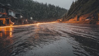 outdoors,sky,tree,no humans,ground vehicle,building,nature,scenery,motor vehicle,snow,forest,snowing,sign,car,road,house,winter,bare tree,street,water,window,fire