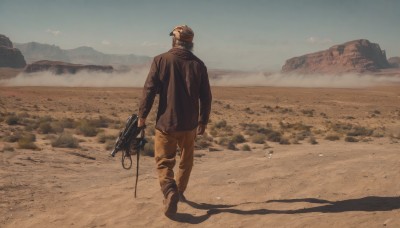 solo,black hair,long sleeves,1boy,hat,holding,standing,jacket,weapon,male focus,boots,outdoors,sky,day,pants,from behind,holding weapon,black jacket,gun,military,shadow,goggles,holding gun,scenery,walking,brown jacket,mountain,sand,brown pants,desert,dust,beach,helmet,rock,sepia,brown theme