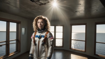 1girl,solo,long hair,looking at viewer,brown hair,gloves,brown eyes,indoors,water,lips,window,ocean,sunlight,reflection,science fiction,curly hair,realistic,sun,pilot suit,spacecraft,hallway,spacesuit,astronaut,blonde hair,long sleeves,closed mouth,standing,upper body,medium hair,star (symbol),bodysuit,parody,light rays,emblem,light,white bodysuit,american flag,ceiling,afro,ceiling light