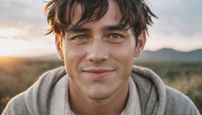 solo,looking at viewer,smile,short hair,brown hair,shirt,1boy,brown eyes,closed mouth,white shirt,upper body,male focus,outdoors,sky,day,cloud,hood,blurry,lips,depth of field,blurry background,facial hair,cloudy sky,portrait,freckles,realistic,nose,stubble,straight-on,bangs,black hair,mole,hoodie,mole on cheek