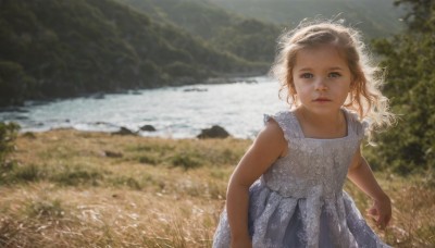 1girl,solo,long hair,looking at viewer,blue eyes,blonde hair,brown hair,dress,outdoors,sleeveless,day,water,white dress,blurry,tree,lips,sleeveless dress,depth of field,blurry background,grass,child,nature,scenery,realistic,river,lake,parted lips,ocean,beach,sunlight,wind,female child,shore