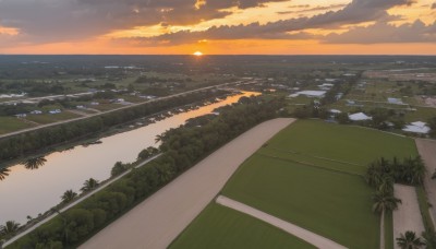 outdoors,sky,cloud,water,tree,no humans,ocean,beach,sunlight,cloudy sky,grass,plant,building,nature,scenery,sunset,sun,horizon,road,bush,river,landscape,shore,orange sky,hill,dutch angle,forest,mountain,city,cityscape