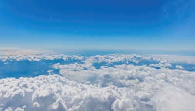 monochrome,outdoors,sky,day,cloud,water,blue sky,no humans,ocean,scenery,blue theme,city,horizon,cityscape,landscape,above clouds