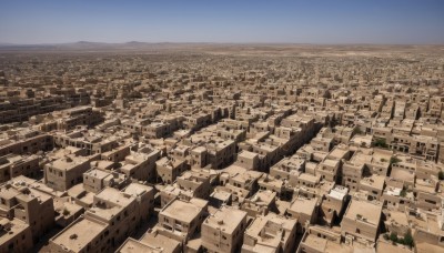 outdoors,sky,day,blue sky,no humans,building,scenery,mountain,city,horizon,cityscape,landscape,town,cloud,water,ocean,from above,skyscraper,shore