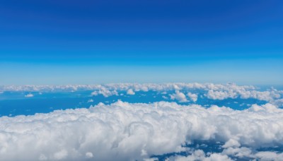 monochrome,outdoors,sky,day,cloud,blue sky,no humans,cloudy sky,scenery,blue theme,city,horizon,cityscape,landscape,above clouds,water,ocean