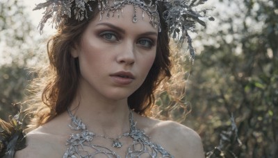 1girl,solo,long hair,looking at viewer,brown hair,hair ornament,bare shoulders,brown eyes,jewelry,collarbone,parted lips,necklace,blurry,lips,grey eyes,eyelashes,depth of field,blurry background,portrait,freckles,realistic,dress,green eyes,upper body,flower,makeup,sunlight,tiara,gem,nose