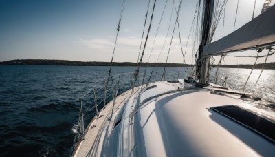 outdoors,sky,day,cloud,water,no humans,shadow,ocean,beach,scenery,sand,horizon,road,watercraft,power lines,ship,waves,boat,shore,blue sky,sunlight