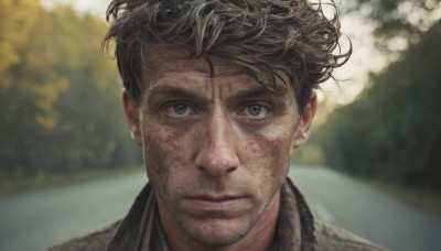 solo,looking at viewer,short hair,brown hair,black hair,1boy,closed mouth,male focus,outdoors,day,blurry,black eyes,grey eyes,depth of field,blurry background,facial hair,messy hair,portrait,beard,freckles,realistic,stubble,straight-on,shirt,jacket,lips,scar,expressionless,scar on face,close-up