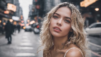 1girl,solo,long hair,looking at viewer,blue eyes,blonde hair,bare shoulders,upper body,outdoors,parted lips,teeth,blurry,lips,depth of field,blurry background,wavy hair,ground vehicle,portrait,motor vehicle,curly hair,realistic,car,road,street,jewelry,collarbone,necklace,head tilt,looking up,forehead,city,crosswalk