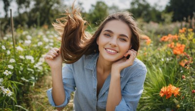 1girl,solo,long hair,looking at viewer,smile,blue eyes,brown hair,shirt,white shirt,upper body,flower,outdoors,teeth,day,collared shirt,grin,blurry,lips,hands up,buttons,floating hair,depth of field,blurry background,blue shirt,wind,head rest,realistic,unbuttoned,holding hair,brown eyes,signature,nail polish,mole,fingernails,grass,denim,sleeves rolled up,garden,denim jacket