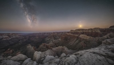 outdoors,sky,cloud,water,no humans,night,ocean,star (sky),night sky,scenery,starry sky,sunset,rock,mountain,horizon,landscape,cliff,space