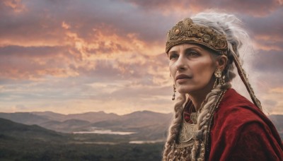 1girl,solo,long hair,brown eyes,jewelry,closed mouth,upper body,braid,white hair,earrings,outdoors,sky,cloud,necklace,twin braids,lips,cloudy sky,scenery,mountain,realistic,headdress,looking afar,old,mountainous horizon,old woman,crown,veil,sunset