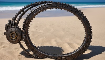 outdoors,sky,day,water,blurry,blue sky,no humans,shadow,ocean,beach,scenery,sand,horizon,gears,steampunk,cloud,depth of field,sunlight,reflection,shade,waves,shore