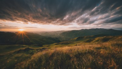 outdoors,sky,cloud,tree,no humans,sunlight,cloudy sky,grass,nature,scenery,sunset,mountain,sun,horizon,field,landscape,mountainous horizon,sunrise,hill,light rays,evening