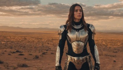 1girl,solo,long hair,blue eyes,brown hair,gloves,brown eyes,standing,outdoors,sky,cloud,armor,lips,looking to the side,bodysuit,cloudy sky,shoulder armor,gauntlets,pauldrons,breastplate,realistic,arms at sides,desert,scenery,field