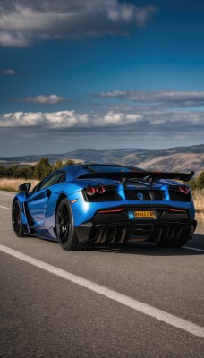 outdoors,sky,day,cloud,tree,blue sky,no humans,cloudy sky,ground vehicle,nature,scenery,motor vehicle,mountain,car,road,vehicle focus,mountainous horizon,sports car,solo,logo,wheel