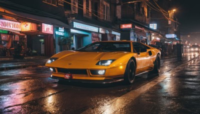 outdoors,no humans,night,ground vehicle,building,scenery,motor vehicle,reflection,city,sign,car,light,road,vehicle focus,lamppost,street,lights,sports car,sky,rain,power lines,shop,radio antenna,neon lights,real world location