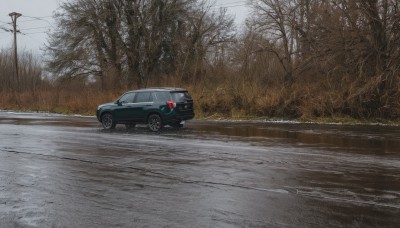 outdoors,sky,tree,no humans,ground vehicle,nature,scenery,motor vehicle,forest,realistic,car,road,vehicle focus,power lines,lamppost,bare tree,street,utility pole,grey sky,sports car,day