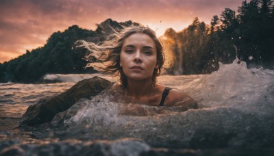 1girl,solo,looking at viewer,blonde hair,brown hair,closed mouth,upper body,outdoors,sky,water,tree,lips,floating hair,wind,nature,scenery,forest,partially submerged,sunset,mountain,realistic,river,long hair,brown eyes,swimsuit,cloud,ocean,rock,waves