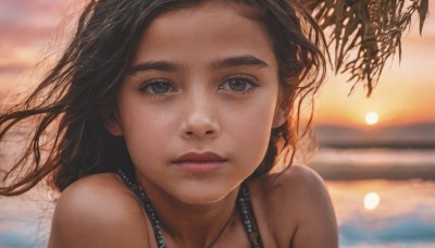 1girl,solo,long hair,looking at viewer,brown hair,black hair,hat,bare shoulders,brown eyes,closed mouth,outdoors,sky,dark skin,water,blurry,black eyes,dark-skinned female,lips,eyelashes,depth of field,blurry background,ocean,wind,portrait,close-up,freckles,sunset,realistic,nose,straw hat,jewelry,necklace,tree,sun