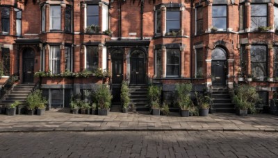 outdoors,sky,day,tree,no humans,window,plant,building,scenery,stairs,door,potted plant,road,pavement,stone stairs,bush,architecture,arch