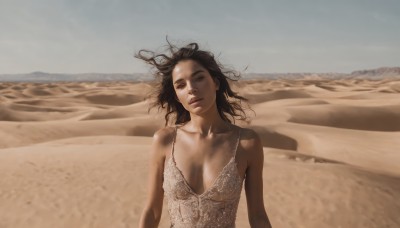 1girl,solo,long hair,breasts,looking at viewer,large breasts,brown hair,black hair,dress,cleavage,bare shoulders,brown eyes,medium breasts,collarbone,upper body,outdoors,parted lips,sky,day,lips,floating hair,beach,wind,messy hair,realistic,sand,desert