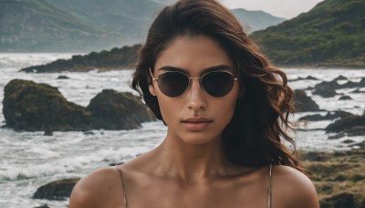 1girl,solo,long hair,looking at viewer,brown hair,bare shoulders,closed mouth,collarbone,upper body,outdoors,day,dark skin,water,dark-skinned female,lips,ocean,beach,sunglasses,portrait,facing viewer,rock,realistic,aviator sunglasses,black hair,waves