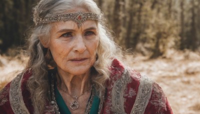 solo,long hair,looking at viewer,blue eyes,1boy,jewelry,closed mouth,upper body,white hair,male focus,outdoors,necklace,blurry,lips,depth of field,blurry background,facial hair,wavy hair,tiara,gem,portrait,circlet,realistic,old,old man,1girl,brown eyes,grey hair,looking to the side,grey eyes,scar,scar on face,freckles,wrinkled skin