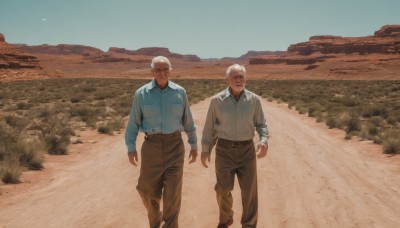 short hair,shirt,long sleeves,standing,jacket,closed eyes,white shirt,white hair,male focus,outdoors,multiple boys,sky,day,collared shirt,belt,pants,2boys,tree,blue sky,feet out of frame,facial hair,grass,blue shirt,scenery,beard,walking,pocket,realistic,field,brown pants,old,old man,desert,wrinkled skin,dark skin,dark-skinned male,mountain,sand,landscape,mountainous horizon