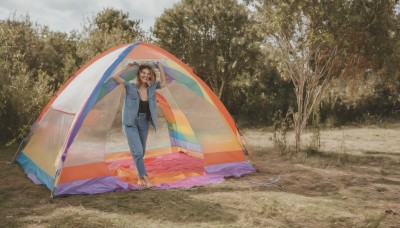 1girl,solo,long hair,smile,open mouth,brown hair,shirt,black hair,1boy,holding,standing,jacket,closed eyes,short sleeves,male focus,outdoors,open clothes,sky,shoes,barefoot,day,pants,arms up,tree,black shirt,open shirt,umbrella,sandals,denim,towel,nature,jeans,wide shot,scenery,photo background