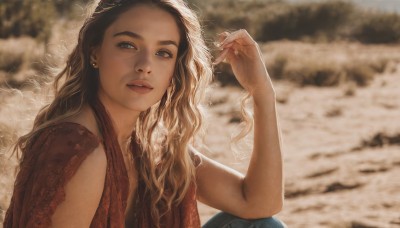 1girl,solo,long hair,looking at viewer,blue eyes,blonde hair,brown hair,black hair,jewelry,upper body,multicolored hair,earrings,outdoors,parted lips,sleeveless,hand up,blurry,lips,depth of field,blurry background,wavy hair,ring,freckles,realistic,sitting,fingernails,sunlight,thick eyebrows,denim,jeans,nose