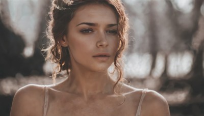 1girl,solo,looking at viewer,brown hair,bare shoulders,brown eyes,collarbone,upper body,parted lips,teeth,bra,blurry,lips,depth of field,blurry background,wavy hair,portrait,freckles,curly hair,realistic,nose,long hair,hair ornament,dress,backlighting